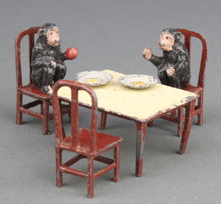 A Taylor & Barrett chimpanzee tea party set comprising table, 3 chairs, 2 chimps and 2 plates 