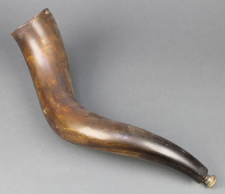 A cow horn with metal mouthpiece 18"  
