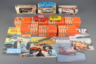 2 VIP slot cars, boxed and 5 VIP slot car boxes containing 2 slot cars (f) and various parts, 5 other slot cars (all f) and a Scalextric 101 circuits brochure, do. model motor racing brochure, a Revell manual for model car racing and a VIP Club raceway brochure 