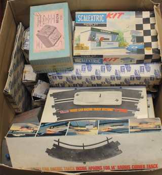 A Scalextric racing pit boxed, a quantity of Revell track (some boxed), 2 Victor power units 