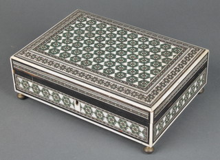An Edwardian Moorish style trinket box inlaid ivory and green hard stones, raised on bun feet 3"h x 9"w x 6 1/2", small sections of veneer are missing  