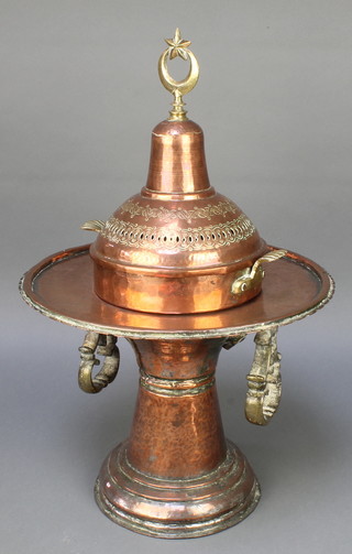 An Eastern copper and brass twin handled pedestal censer with crescent moon finial 20"h x 14" diam. 