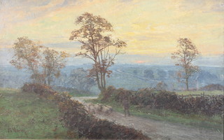 J C Morley, oil on board, signed, study of a shepherd and sheep in a country lane at sunset 11 1/2" x 18"