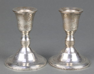 A pair of Sterling silver dwarf candlesticks of vase form 3 1/2" 