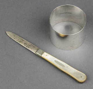 A silver napkin ring Birmingham 1912 a silver and mother of pearl fruit knife