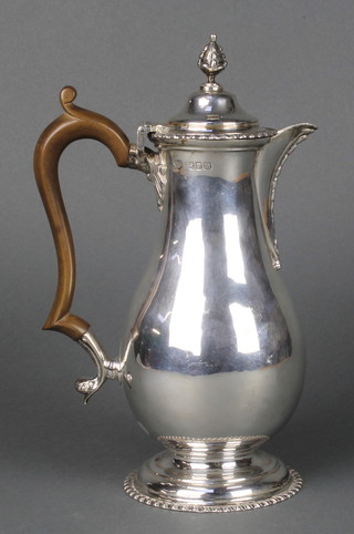A Queen Anne style silver baluster coffee pot with beaded decoration and fruitwood handle,Goldsmiths & Silversmiths Co London 1947 9 1/2", gross weight 544 grams