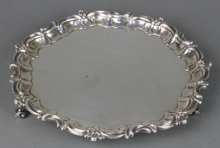 A Victorian silver salver with fancy rim on scroll feet, Walter & Charles Sissons London 1896, 635 grams 10" 