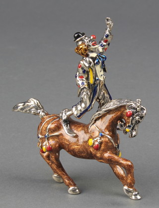 A Continental silver and enamelled figure of a clown standing on a horse, 3 1/2",  142 grams 