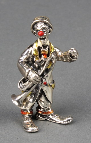 A Continental silver and enamelled clown holding a trombone, 2.25"  46 grams