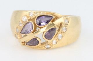 A 14ct yellow gold amethyst and gem set ring, size O 