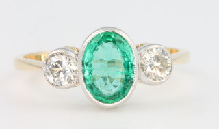 An 18ct yellow gold emerald and diamond 3 stone ring, size P 1/2