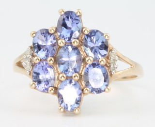 A 9ct yellow gold tanzanite and gem set cluster ring size R 1/2