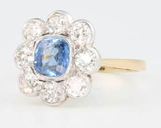 An 18ct yellow gold sapphire approx. 1.20ct and diamond approx. 1.35 cluster ring size R 