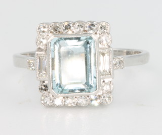 An 18ct white gold aquamarine approx. 1.40ct and diamond surround approx. 0.30ct Art Deco style ring, size N 
