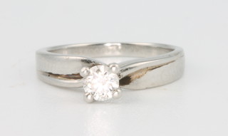 A platinum single stone diamond ring 0.23ct, size F 1/2
