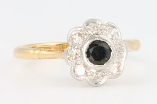 An 18ct yellow gold sapphire and diamond cluster ring size I 1/2