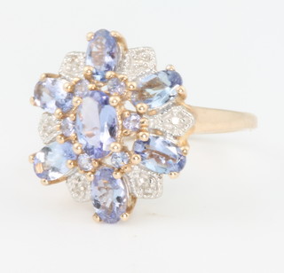 A 9ct yellow gold tanzanite and gem set ring size J 1/2