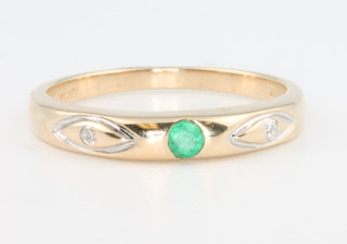 A 9ct yellow gold emerald and diamond ring size M 