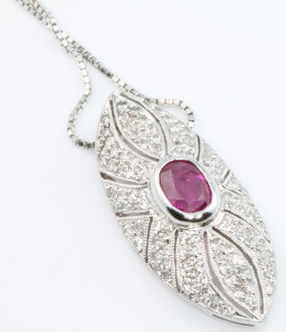 An 18ct white gold Edwardian style ruby and diamond pendant on a ditto chain 