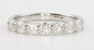 An 18ct white gold 7 stone diamond ring, approx. 0.88ct, size M 