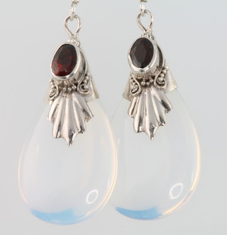 A pair of silver drop earrings with garnets and opaline stones 