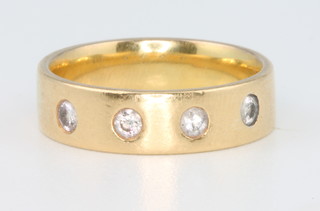 An 18ct yellow gold diamond set ring, size O 1/2, 7.3 grams