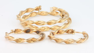 2 pairs of 9ct yellow gold twist hoop earrings 5.3 grams