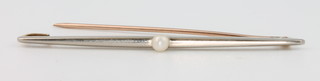 An 18ct white gold pearl set bar brooch 1.7 grams
