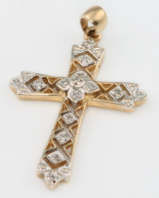 A 9ct yellow gold diamond set cross 2 grams