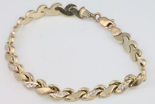 A 14ct yellow and white gold bracelet 5.7 grams