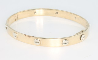 A 9ct yellow gold Cartier style bangle 23.8 grams