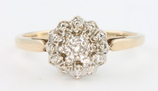 A 9ct yellow gold diamond set cluster ring, size S 1/2, 2.5 grams