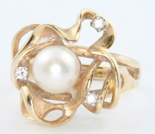 A 14ct yellow gold pearl and diamond dress ring, size L