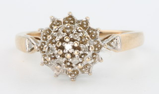 A 9ct yellow gold diamond set cluster ring, size N 1/2, 2.2 grams 