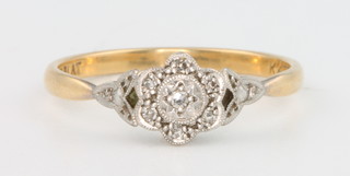 An 18ct yellow gold diamond cluster ring size Q, 2.6 grams