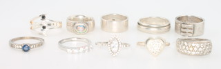 Ten silver dress rings, 44 grams