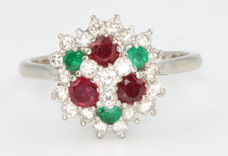 An 18ct white gold diamond and gem set ring, size P 1/2