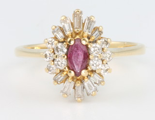 An 18ct yellow gold ruby brilliant and baguette diamond dress ring, size M 