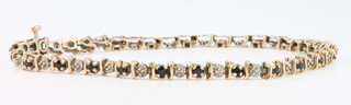 A 9ct yellow gold diamond and sapphire bracelet 