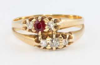 An 18ct yellow gold ruby and diamond double ring, size O