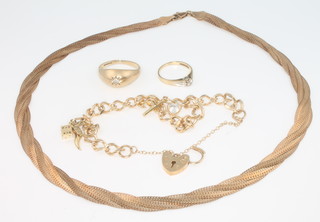 A 9ct yellow gold necklace, a ditto charm bracelet, 2 rings size I and P, gross 24 grams