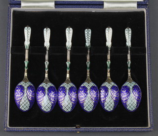 A set of cased silver and enamelled coffee spoons Birmingham 1964