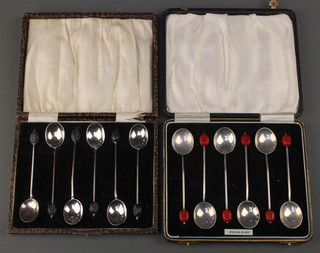 Two cased sets of silver bean end coffee spoons, Birmingham 1928 and 1934