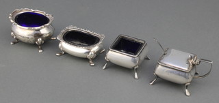 A silver 2 piece condiment of square form on pad feet, 2 silver salts, 126 grams
