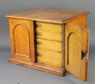 An Edwardian oak canteen with 4 fitted drawers