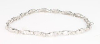 A 10ct white gold baguette cut tapered diamond bracelet, approx. 2ct