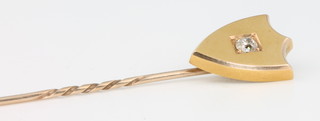 An Edwardian yellow gold diamond set shield shaped tie pin 