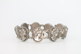 A silver 9 plaque bracelet with female portrait busts