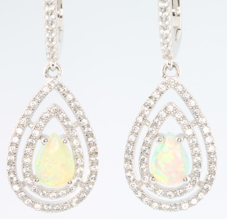 A pair of silver cubic zirconia and gem set pear shaped earrings 