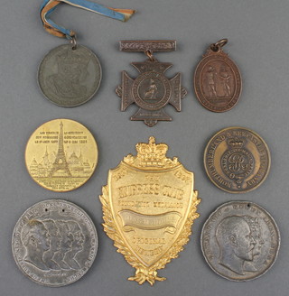 A Victorian Empress Club gilt jewel and minor commemorative coins and medallions 